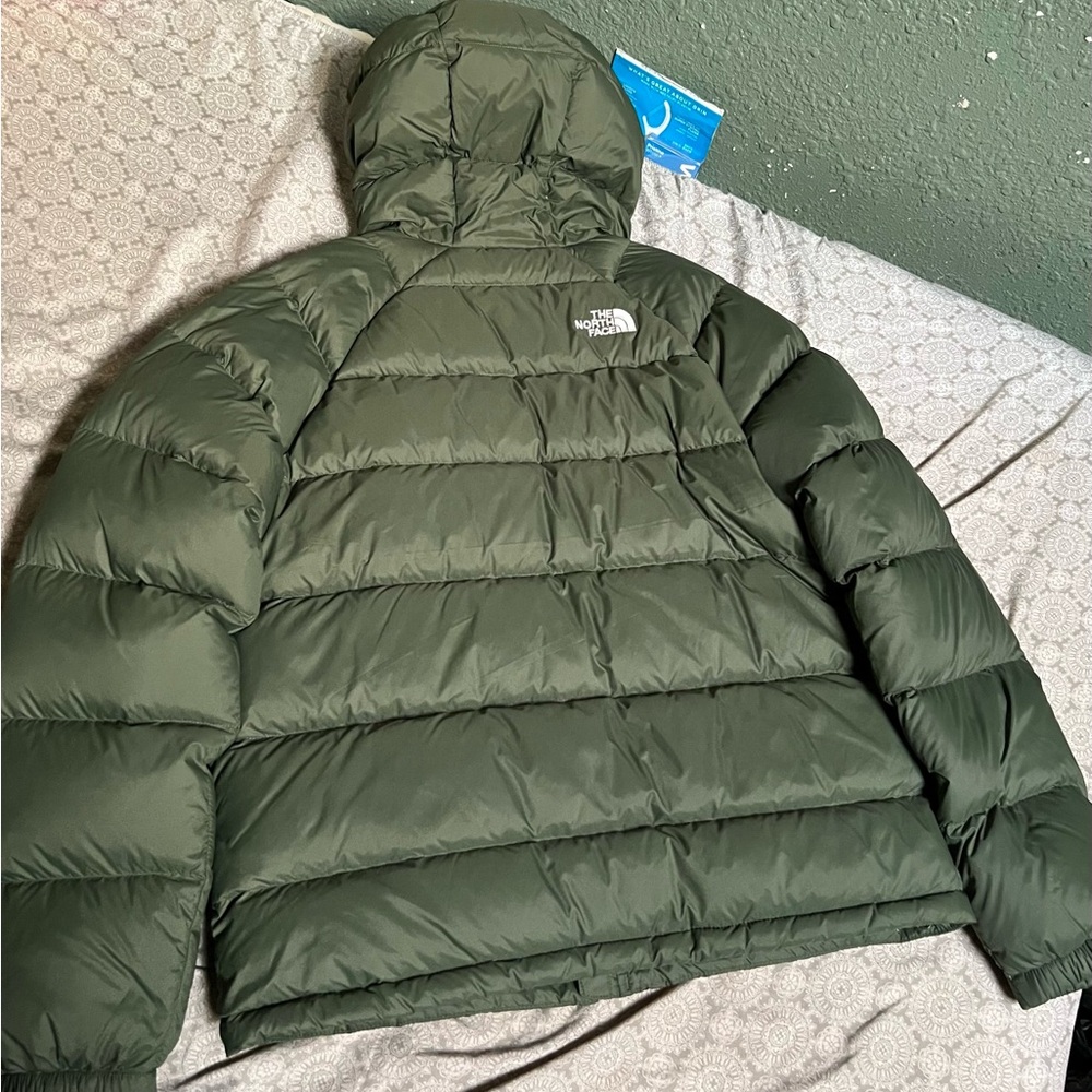 Selling this north face green jacket is brand new offers are welcomed